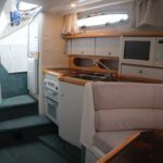 Cockpit access with galley to port