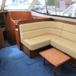 dark wood cream furniture and royal blue carpets for sedan interior