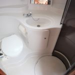 white and dark wood interior lavatory