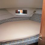 stripped double bed in main bedroom